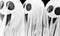 Three white ghosts  on a black background