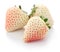 Three white strawberries