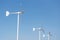 Three wind turbine on blue sky