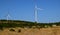 Three wind turbines, blue sky lanscape