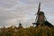 Three windmills at first light in a traditional Holland Landscape.