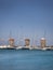 The three Windmills of Mandraki Harbour in Rhodes. Copy space at both the top and bottom of image.