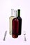 Three wine bottles with knife and fork.