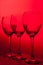 Three wineglasses on red background