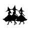 Three witches dancing at a Halloween party.