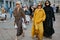 Three women with browm yellow and black outfits before Max Mara fashion show, Milan Fashion