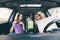 Three Women have fun together in the car after shoping