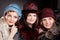 Three women mother and daughters wearing felt hats in retro style