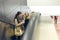 Three women moving up on escalator