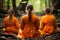 Three women in orange robes sitting in the woods. Generative AI image.