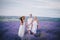 Three women posing in a lavender field