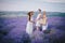 Three women posing in a lavender field