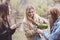 Three women pour hot cocoa