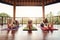 Three women practicing paschimottanasana pose at yoga class