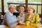 Three women with selfie stick.