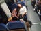 Three women sleep in a full train