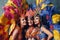 Three Women smiling portrait in brazilian samba carnival costume with colorful feathers plumage