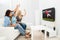 Three women watching rugby match