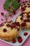 Three wood strawberry muffins on plate