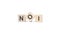 three wooden blocks with the text NOI - an abbreviation for Net Operating Income. white background