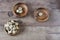 Three wooden bowls with quail eggs. Rustic wood background, diffused natural light. A different type of concept image