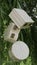 Three wooden boxes in the shape of a circle, heart and cube attached to the branches of the willow in the spring