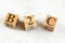 Three wooden cubes with letters B2C stands for Business to Customer on white board