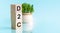 Three wooden cubes with letters D2C - short for Direct-to-Consumer, concept