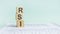 Three wooden cubes with letters RSI - means Relative Strength Index, on white table.