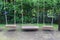 Three wooden swing hanging in playground garden