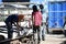 Three worker group working in steel fabrication factory