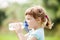 Three year child drinking from bottle