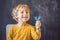 Three-year old boy shows myofunctional trainer. Helps equalize the growing teeth and correct bite, develop mouth