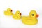 Three yellow bath rubber ducks