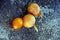 Three yellow bulbs lie on the street on ice