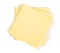 Three yellow cheese slices packaged on white background. Close-up, top view