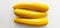 Three yellow courgettes, pumpkin in white background