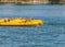 Three yellow kayaks floating on the waters of a lake near Bucharest. Kayaks on Mogosoaia lake