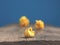 Three yellow paper balls on a table