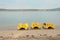 Three yellow pedal boats for rent