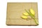 Three yellow tulips tied with a rope to cardboard box flat lay