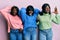 Three young african american friends wearing wool winter sweater crazy and scared with hands on head, afraid and surprised of