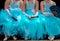 Three young ballerinas in turquise tutu dresses