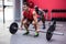 Three young Bodybuilders doing weightlifting