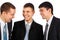 Three young businessmen laugh