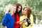 Three young female photographers watching photos