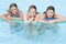 Three young girl friends in swimming pool