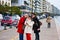 Three young girls make selfy with mono-pod on Leof Nikis Street in Thessaloniki Greece March 2018. Tourists make picture themselve