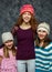 Three young girls in wool hats