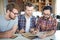 Three Young Men in Modern Office